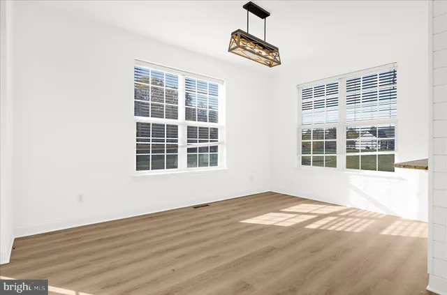 a view of walk in closet with clothes