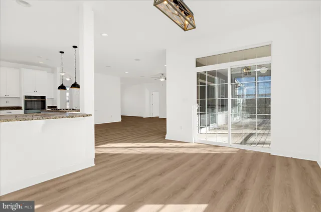 a view of walk in closet with clothes