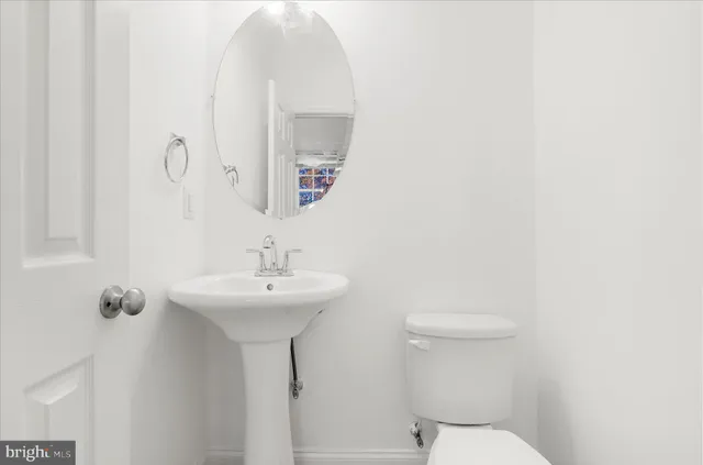 a view of a livingroom with a hardwood floor and a ceiling fan