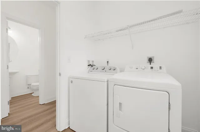 a bathroom with a granite countertop sink mirror and a shower