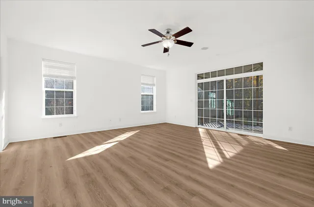 a bathroom with double vanity and a mirror