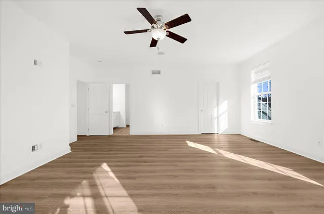a bathroom with a double vanity sink a toilet and a mirror