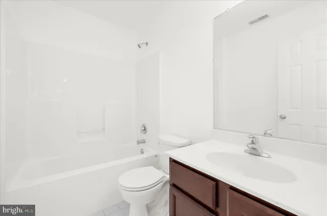 an aerial view of a house with a swimming pool and outdoor seating