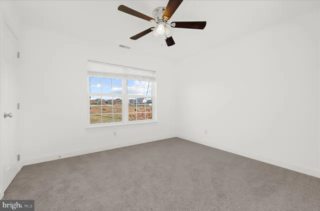 an aerial view of a house with a lake view