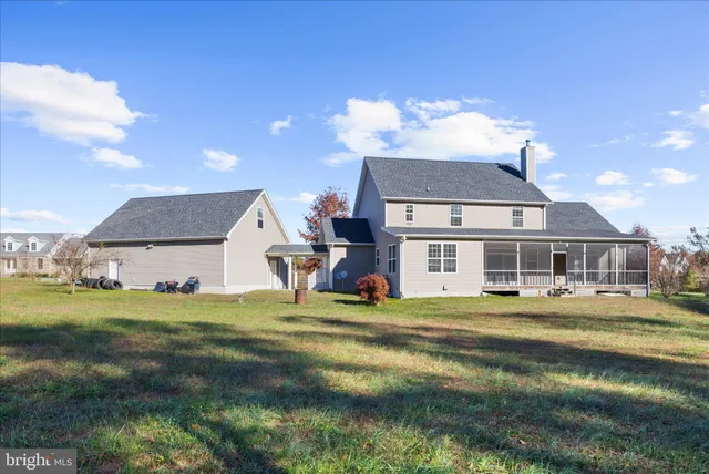 a view of a dining room with furniture and window
