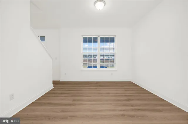 a view of a small space with wooden floor