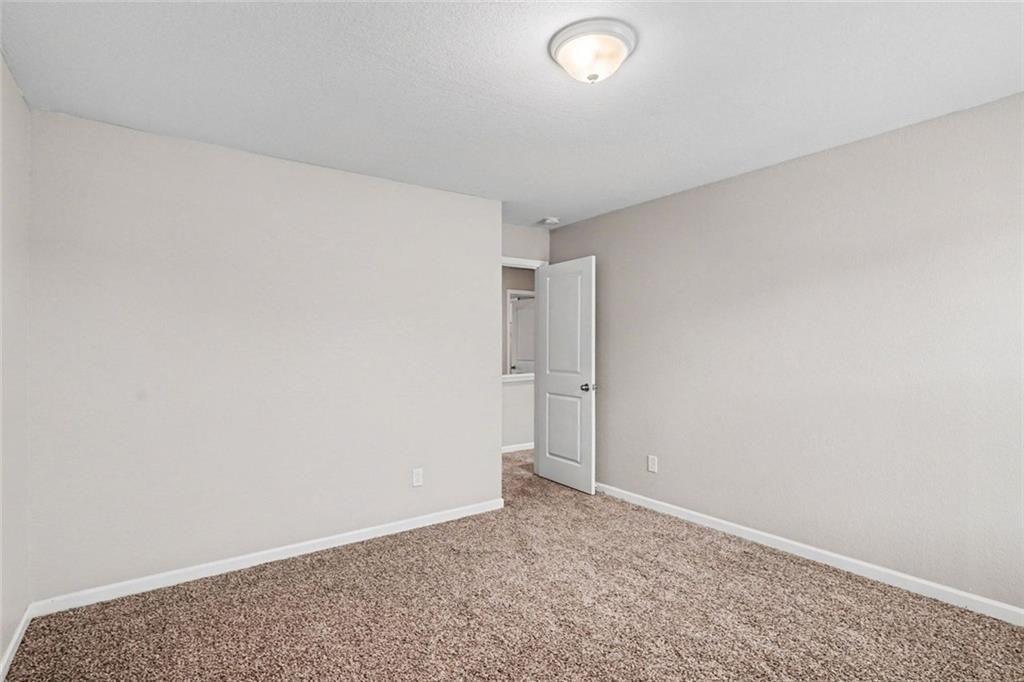 10941 Wheeler Trace Hampton, GA 30228 - Photo 12 of 21 a view of an empty room