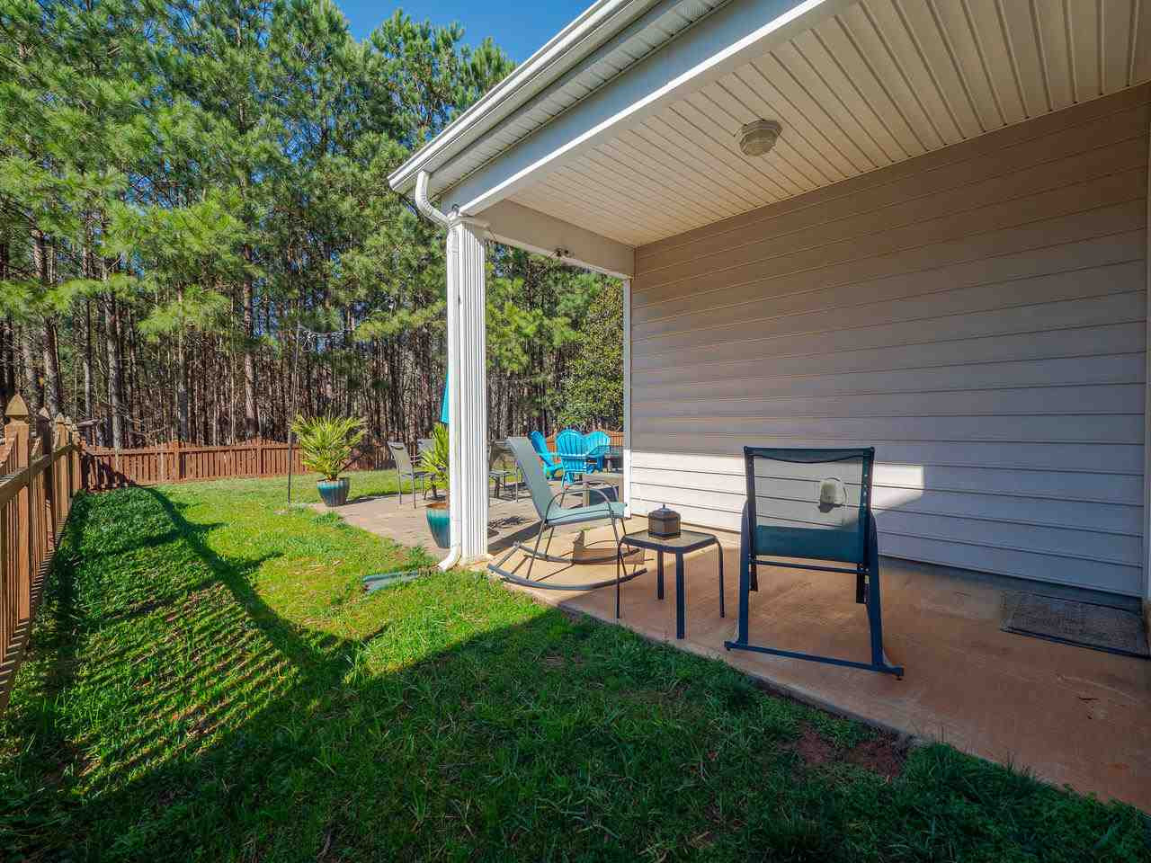8429 Whisper Ridge Place Raleigh, NC 27613 - Photo 22 of 27 Past the sliding glass doors, enjoy the covered side patio area
