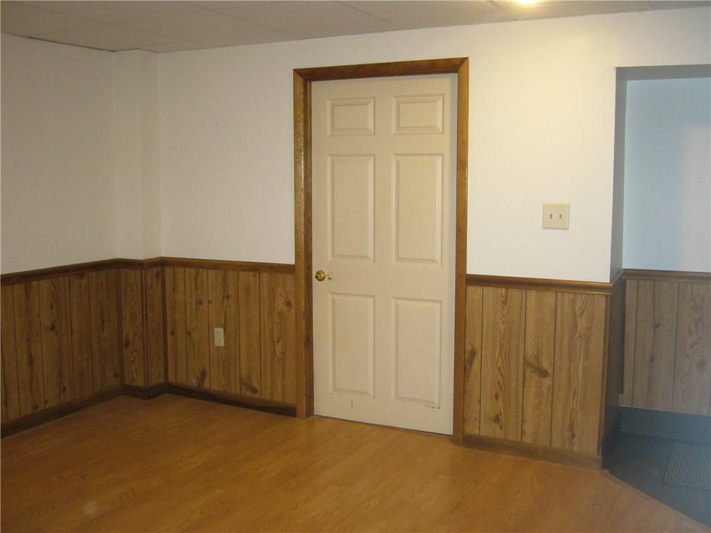 1206 Midland Beaver Road Industry, PA 15052 - Photo 13 of 19 Lower level family room, with entrance to storage, laundry, and mechanicals.