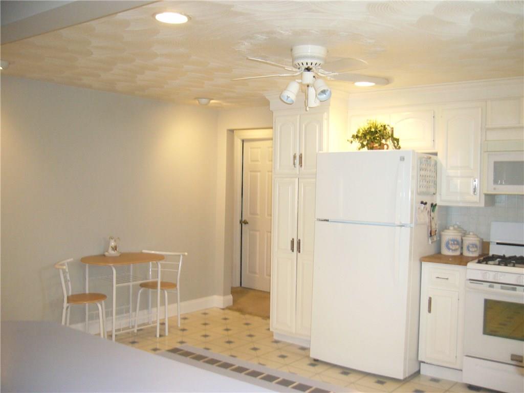 1206 Midland Beaver Road Industry, PA 15052 - Photo 5 of 19 Room for this bistro table but definitely space for a bigger table. Lots of recessed light through out the living space.