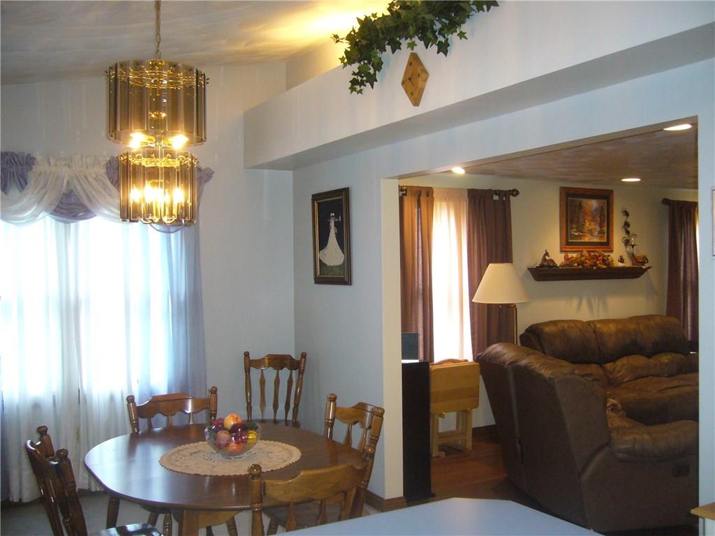 1206 Midland Beaver Road Industry, PA 15052 - Photo 6 of 19 Dining room with cathedral ceiling gives this room a larger feel. Spot lighting on decorative ledge give a warm feeling.