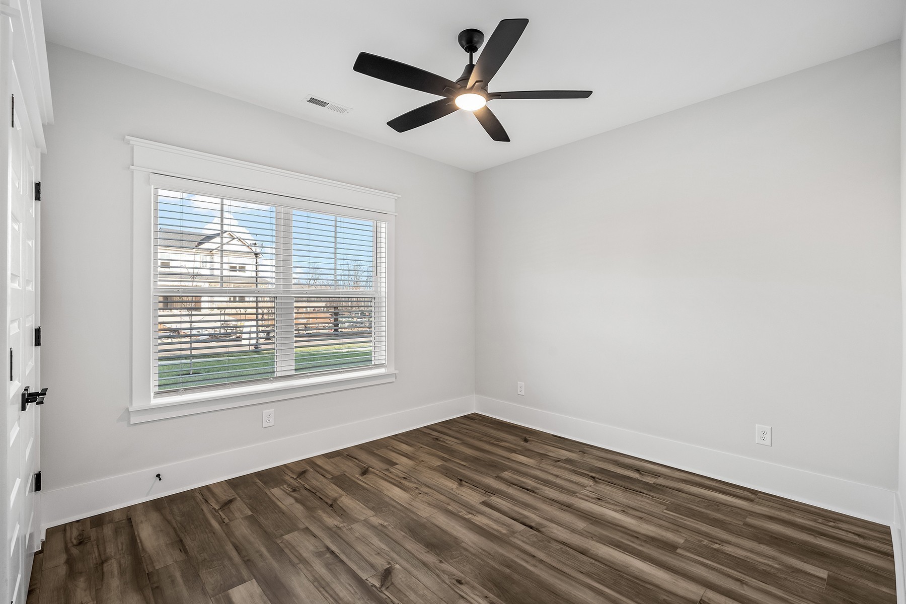 737 Brownlow Road White House, TN 37188 - Photo 15 of 16 a view of empty room with wooden floor and fan