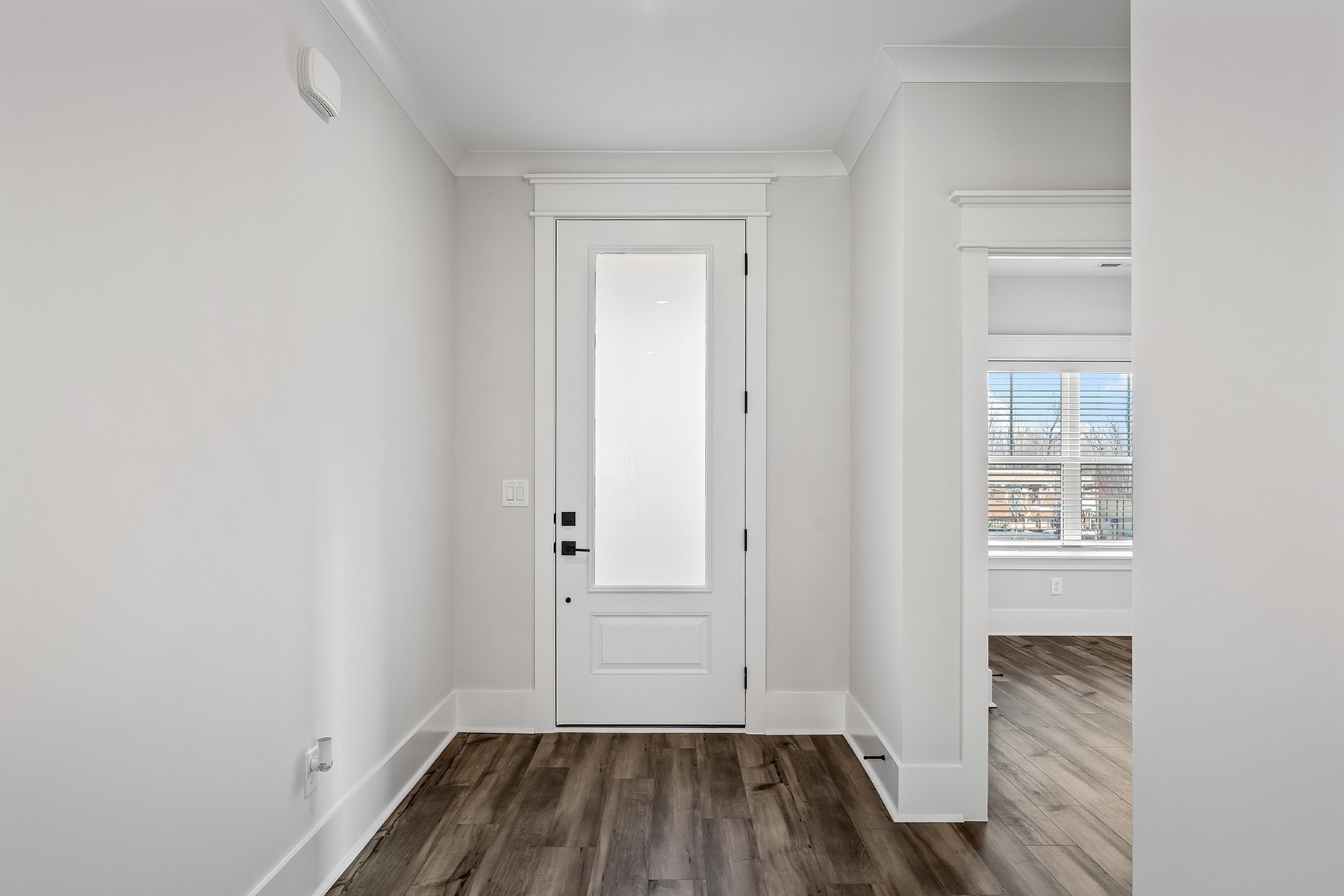 737 Brownlow Road White House, TN 37188 - Photo 2 of 16 an empty room with wooden floor and windows
