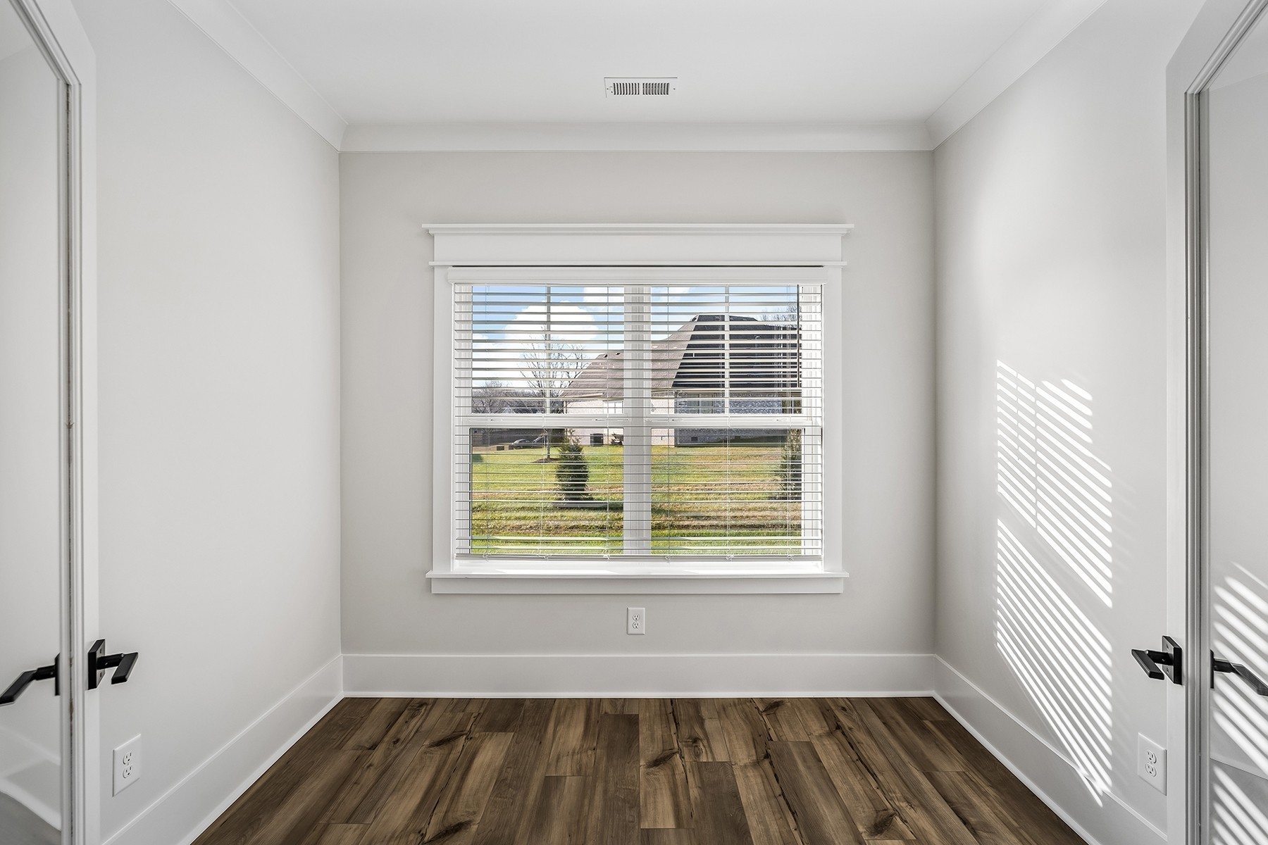 737 Brownlow Road White House, TN 37188 - Photo 8 of 16 a view of a room with wooden floor and windows