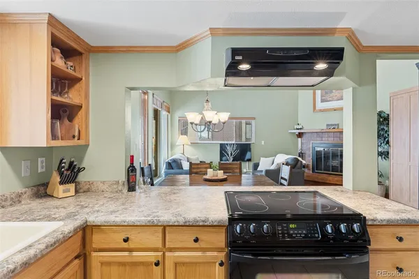 a kitchen with a stove and cabinets