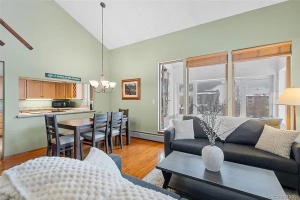 a living room with furniture and a table
