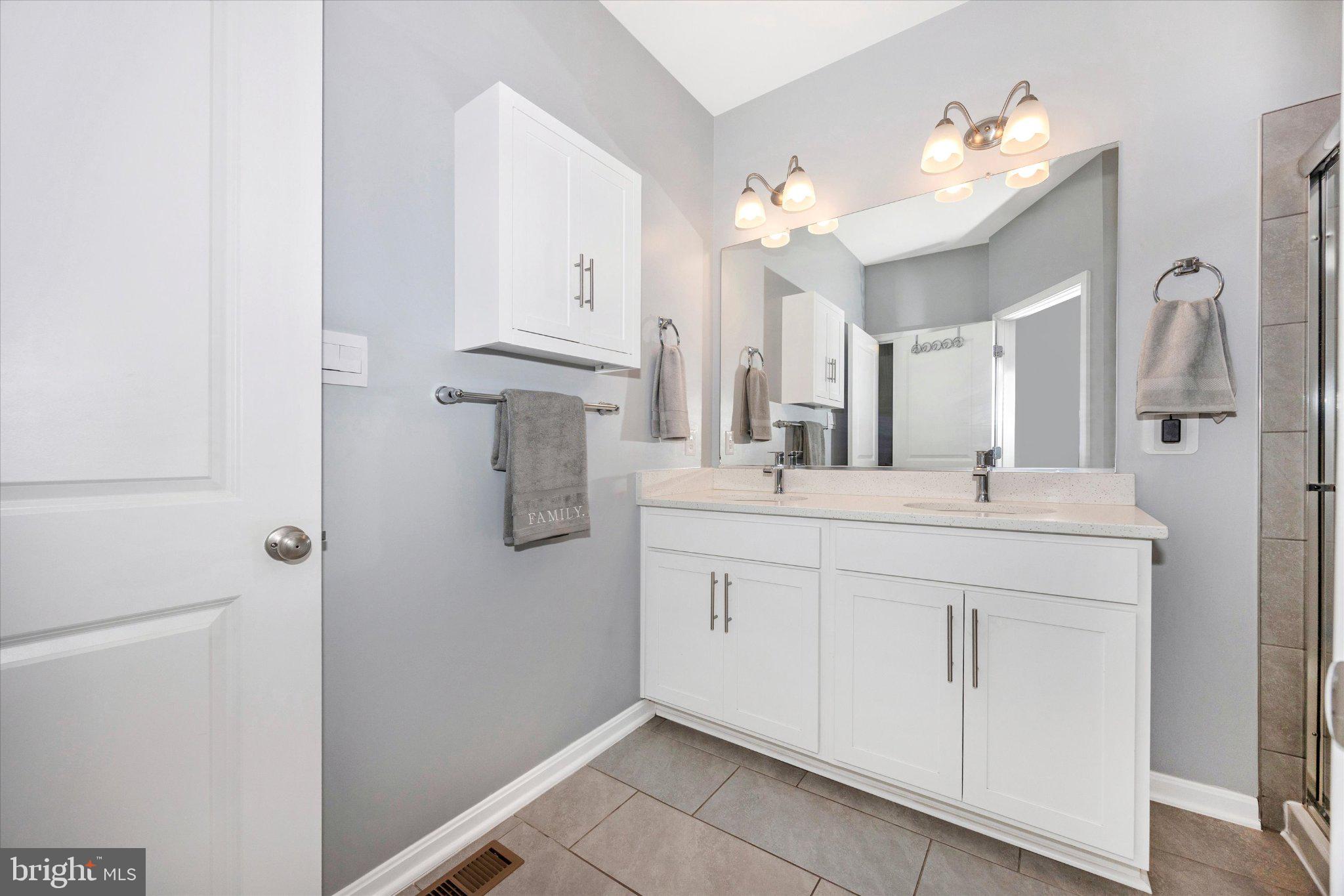 867 Amity Street Frederick, MD 21701 - Photo 39 of 61 Double bowl vanity and tile floor