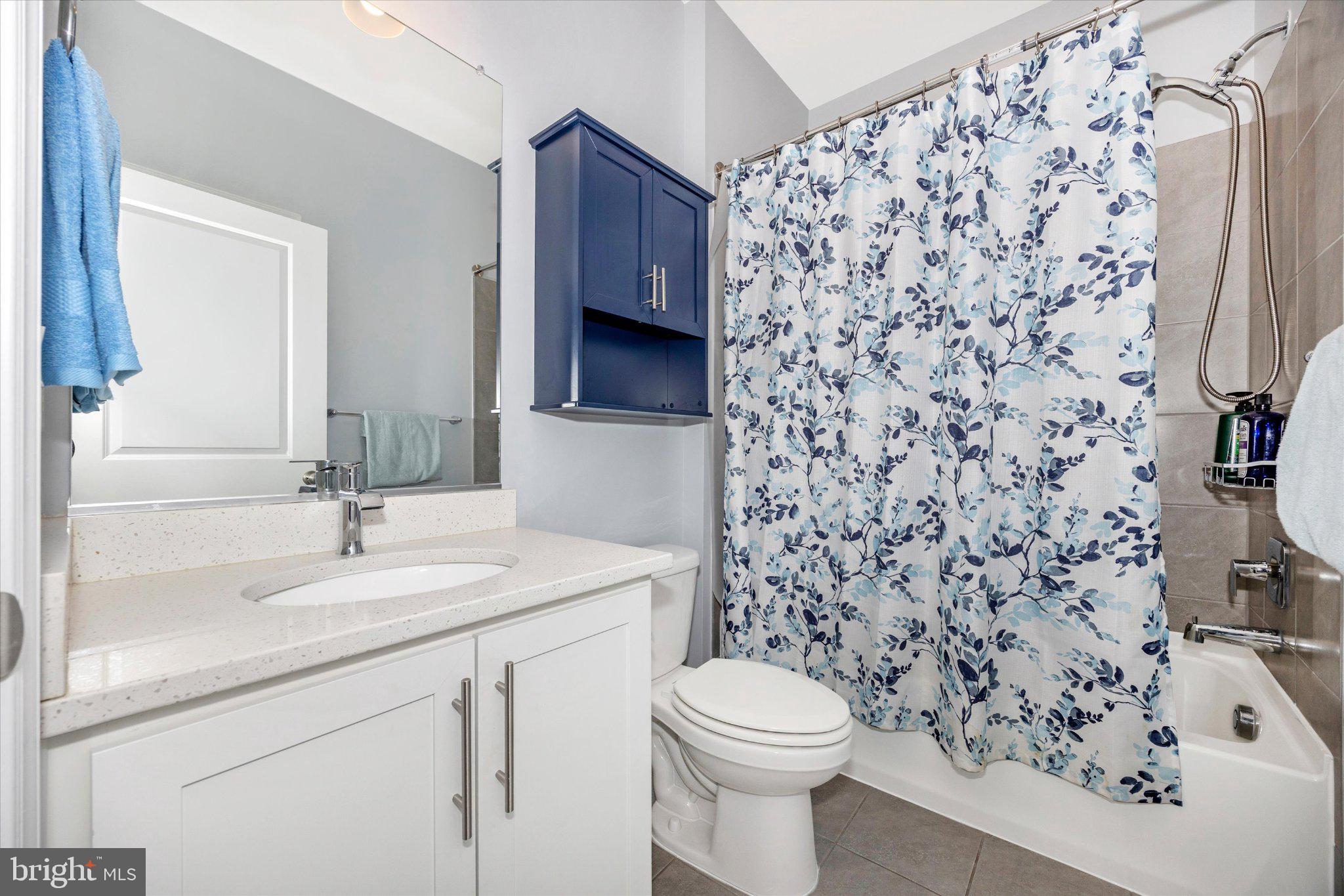 867 Amity Street Frederick, MD 21701 - Photo 45 of 61 Hallway full bath w/ tile floor and tile surround