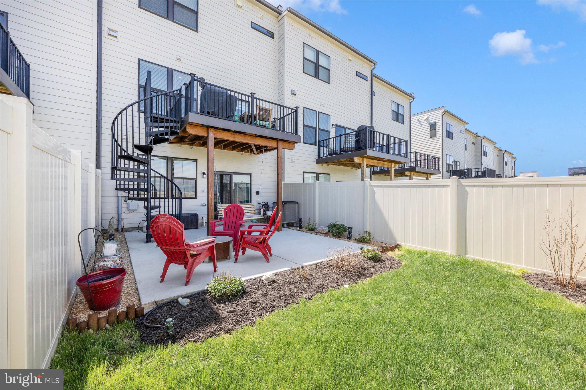 867 Amity Street Frederick, MD 21701 - Photo 53 of 61 Patio with spiral staircase to deck.