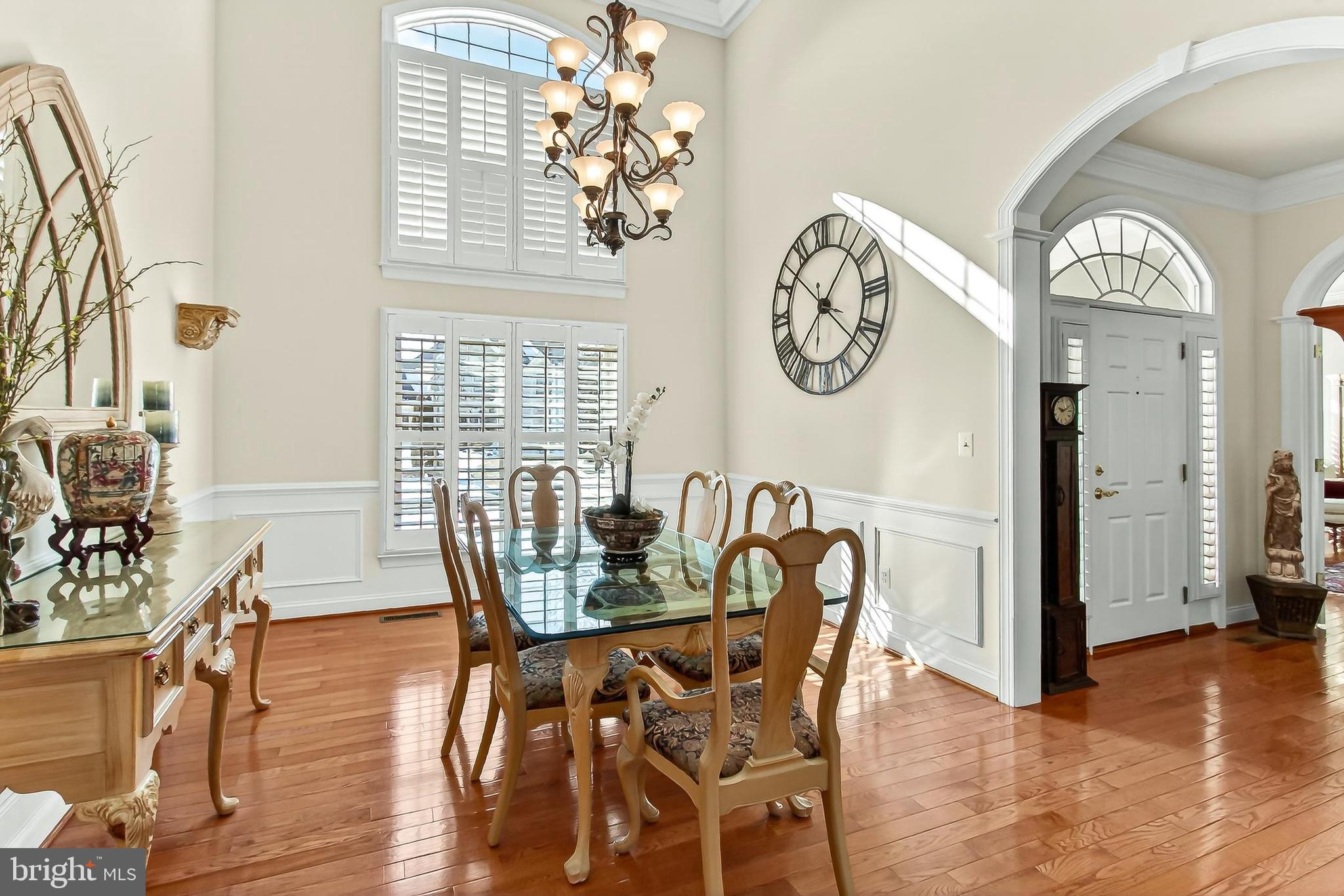 8471 Link Hills Loop Gainesville, VA 20155 - Photo 24 of 65 a view of a dining room with furniture window and wooden floor