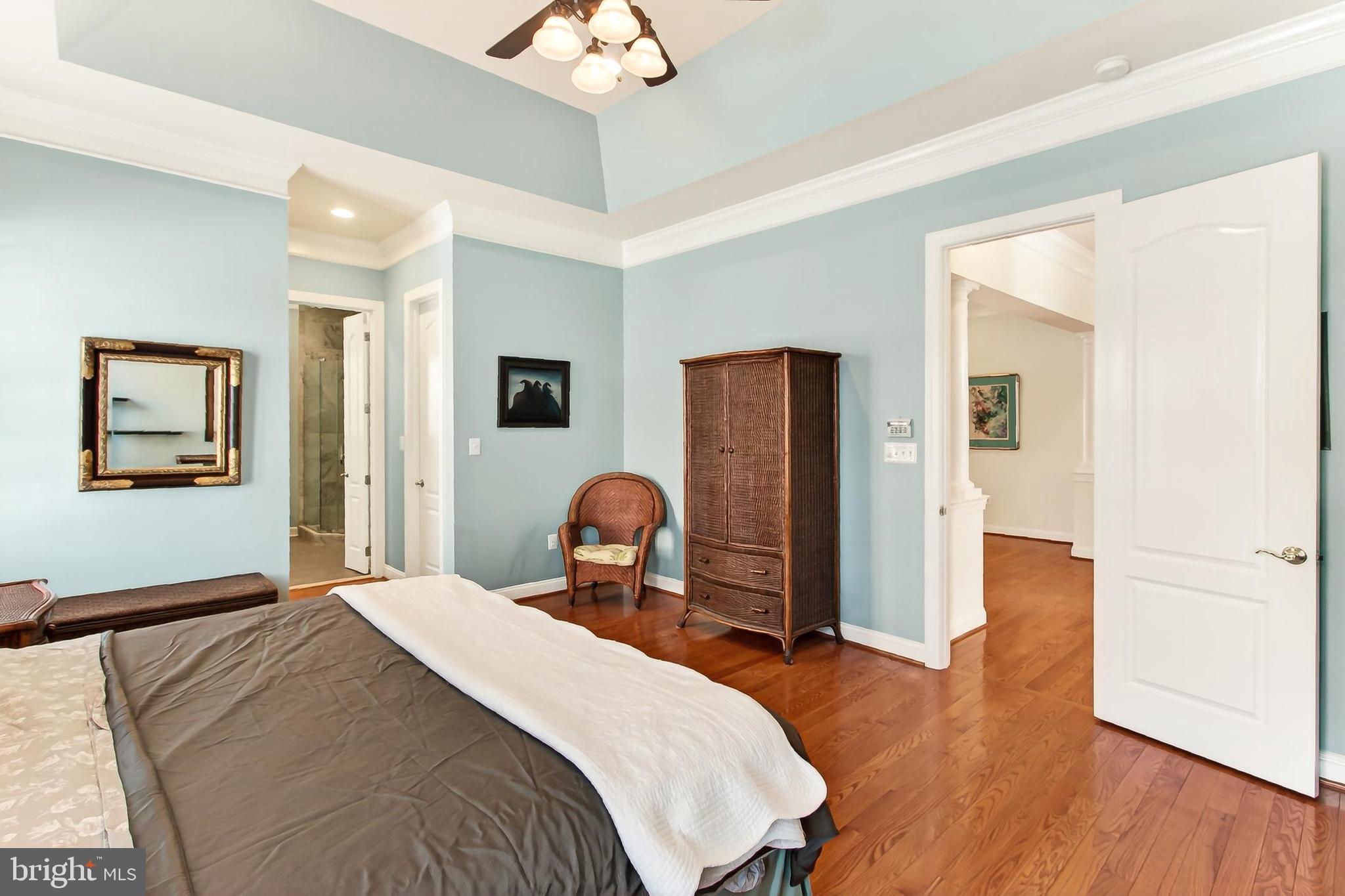 8471 Link Hills Loop Gainesville, VA 20155 - Photo 30 of 65 a bedroom with a bed and a chandelier