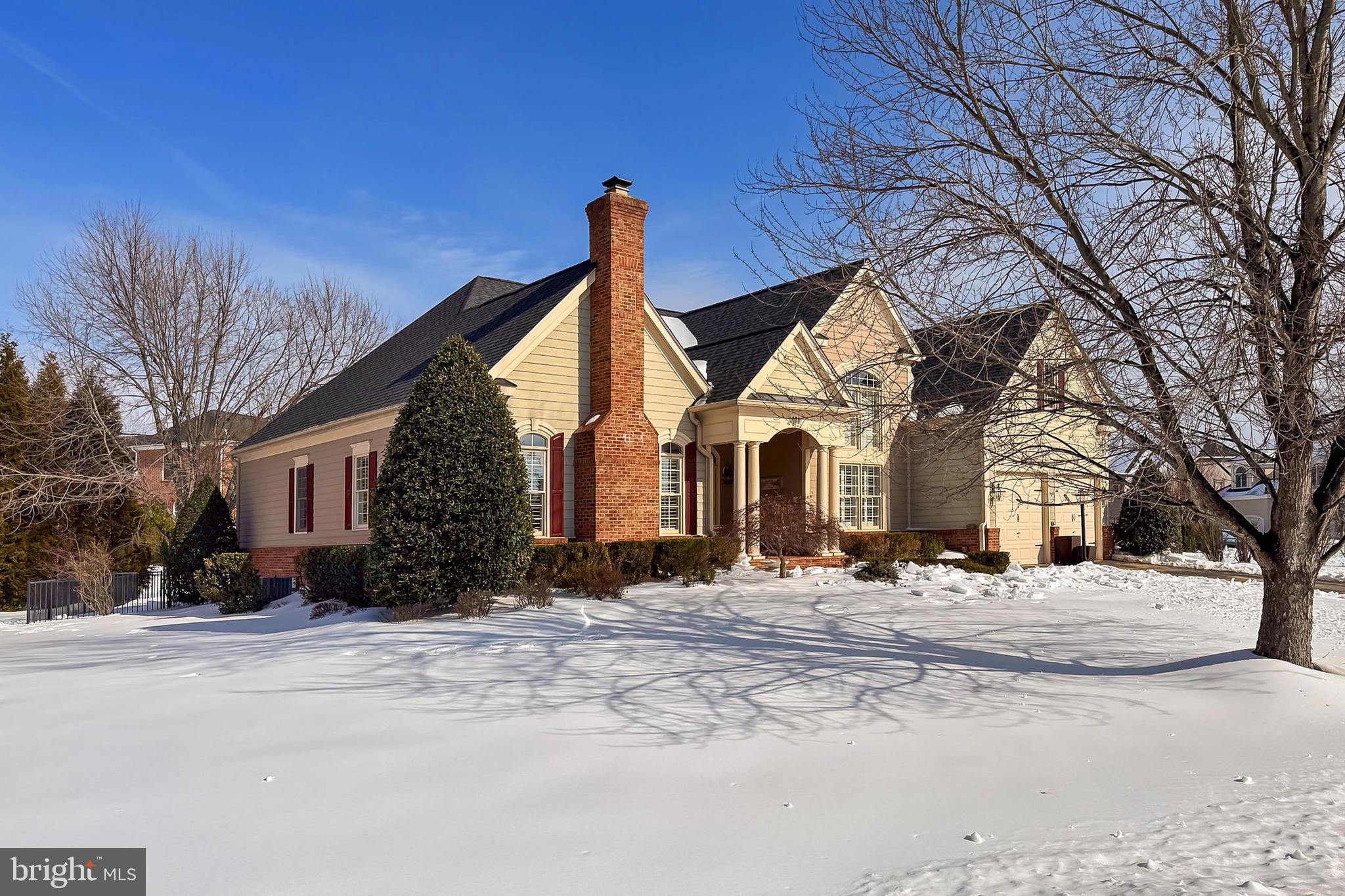 8471 Link Hills Loop Gainesville, VA 20155 - Photo 3 of 65 a view of a white house with a snow on the road