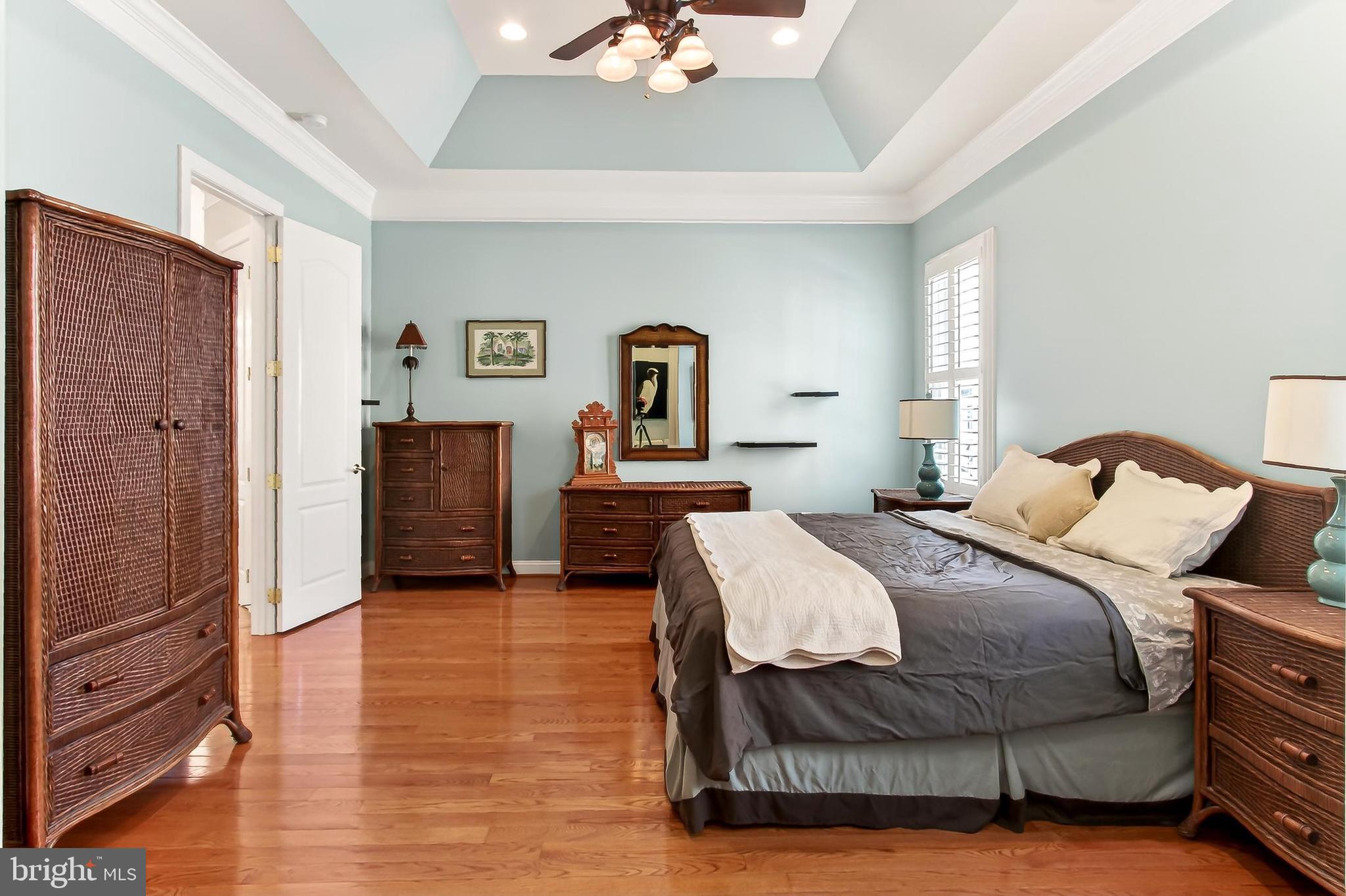 8471 Link Hills Loop Gainesville, VA 20155 - Photo 31 of 65 a bedroom with a bed and a chandelier