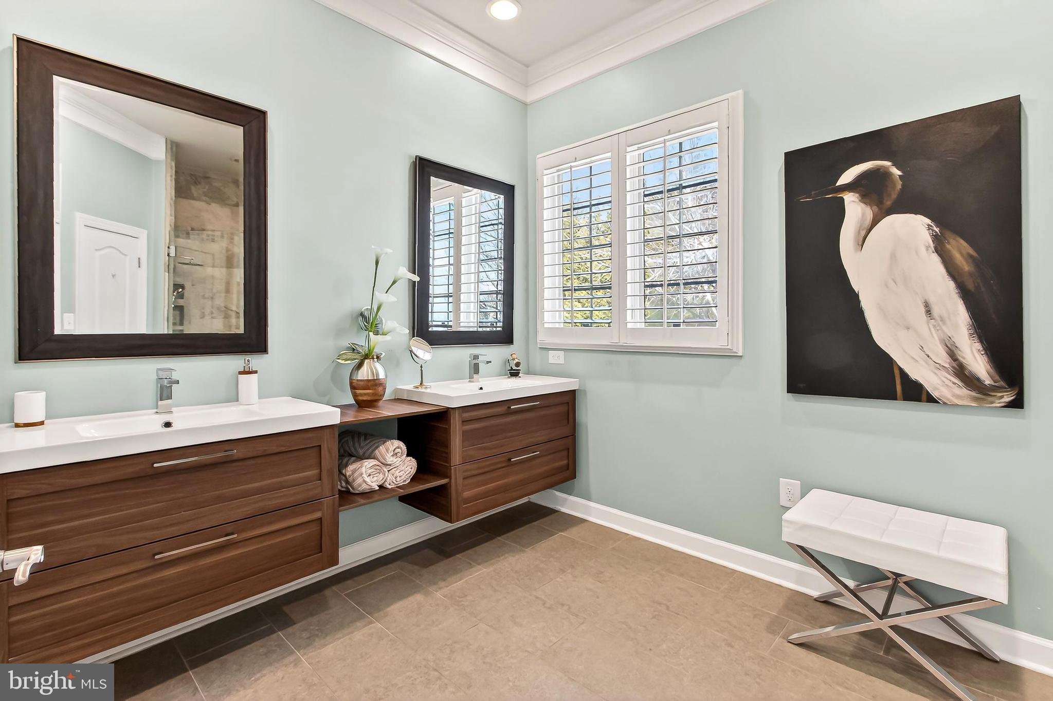 8471 Link Hills Loop Gainesville, VA 20155 - Photo 32 of 65 a spacious bathroom with a double vanity sink and a mirror