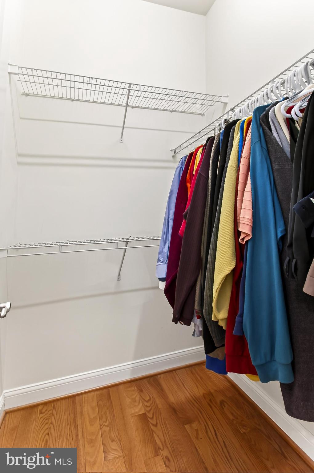 8471 Link Hills Loop Gainesville, VA 20155 - Photo 36 of 65 a view of walk in closet with clothes and shoes