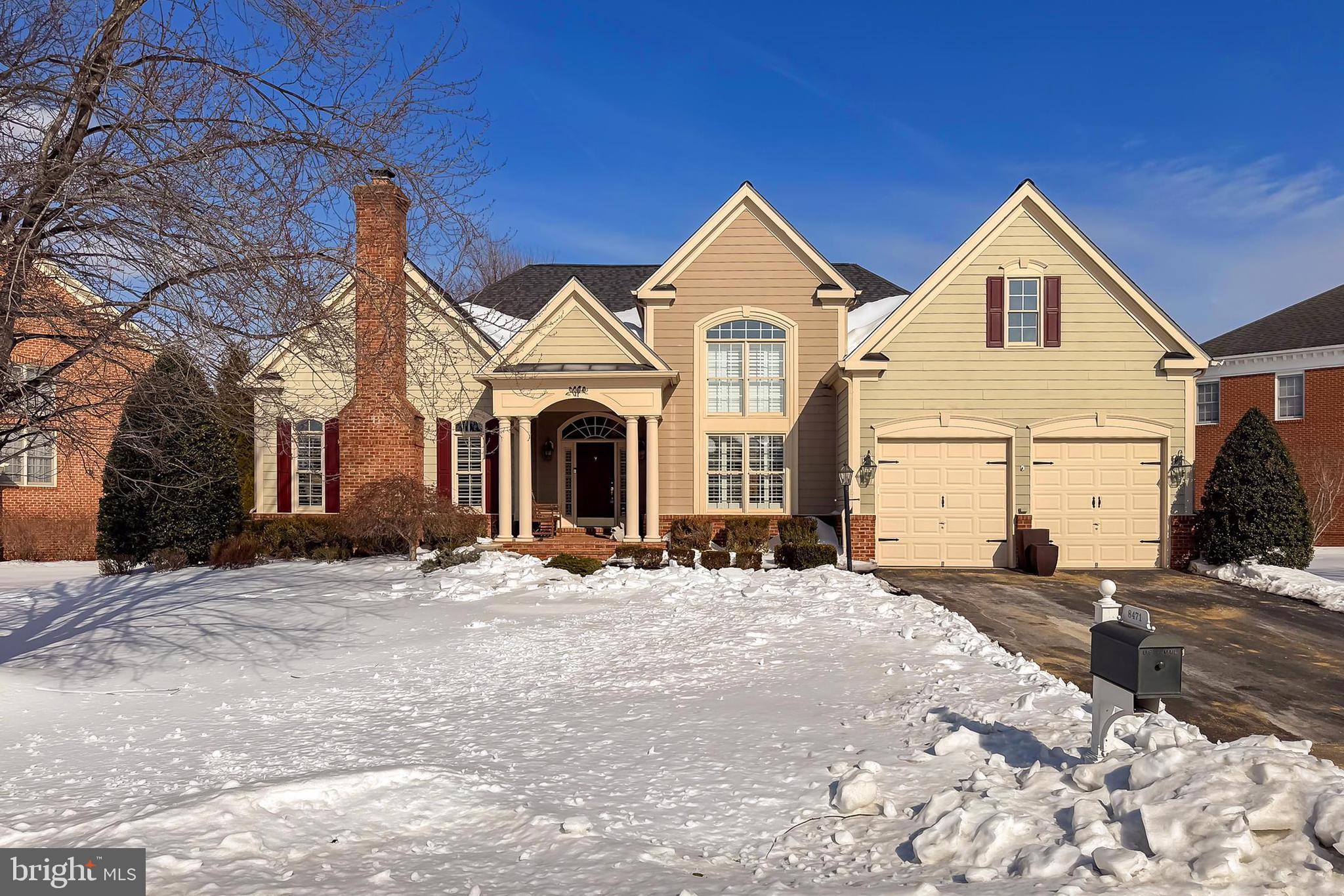 8471 Link Hills Loop Gainesville, VA 20155 - Photo 4 of 65 a front view of a house with a yard