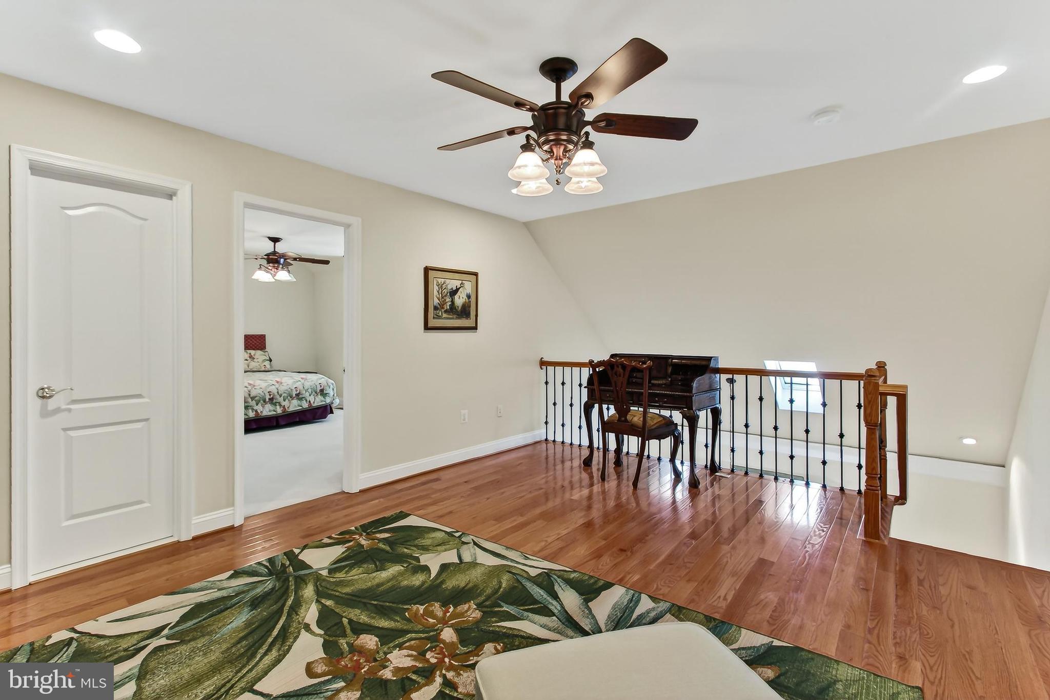 8471 Link Hills Loop Gainesville, VA 20155 - Photo 42 of 65 a living room with furniture and a wooden floor
