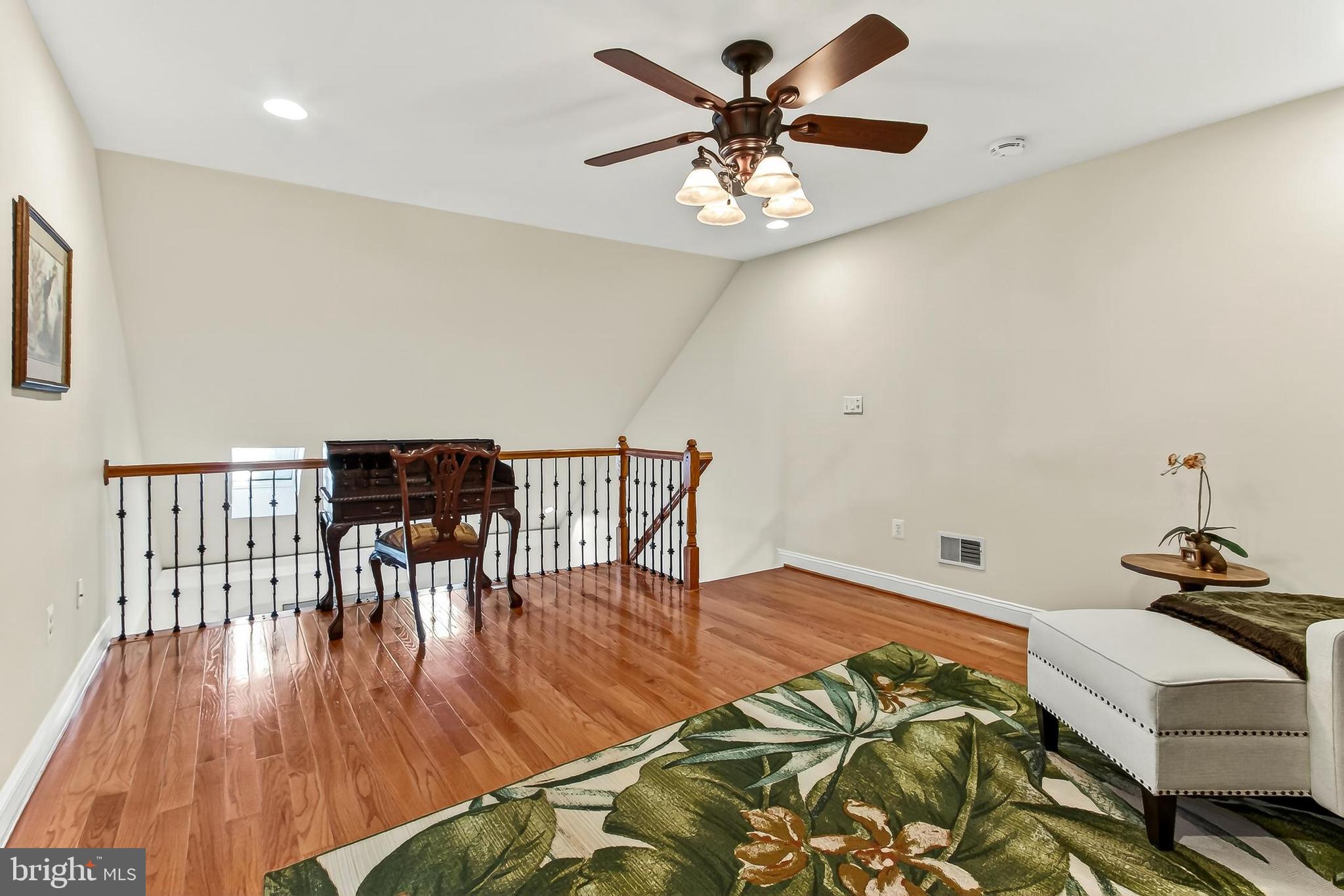8471 Link Hills Loop Gainesville, VA 20155 - Photo 43 of 65 a view of a dining room with furniture and wooden floor