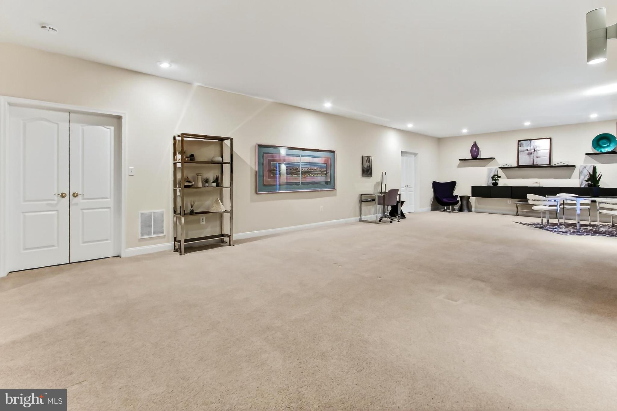 8471 Link Hills Loop Gainesville, VA 20155 - Photo 46 of 65 a view of a livingroom with furniture and a large window