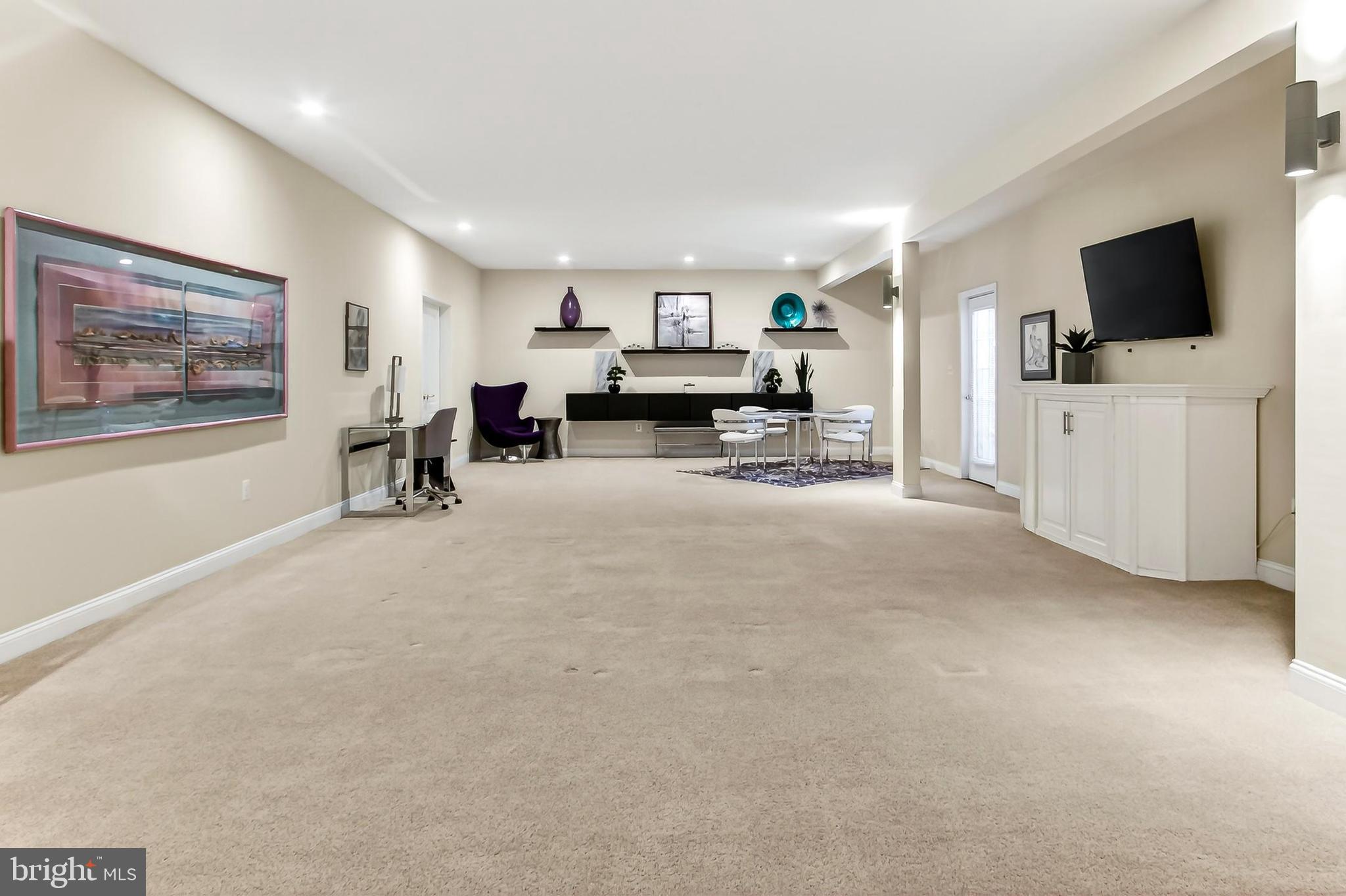 8471 Link Hills Loop Gainesville, VA 20155 - Photo 47 of 65 a view of a livingroom with furniture and a flat screen tv