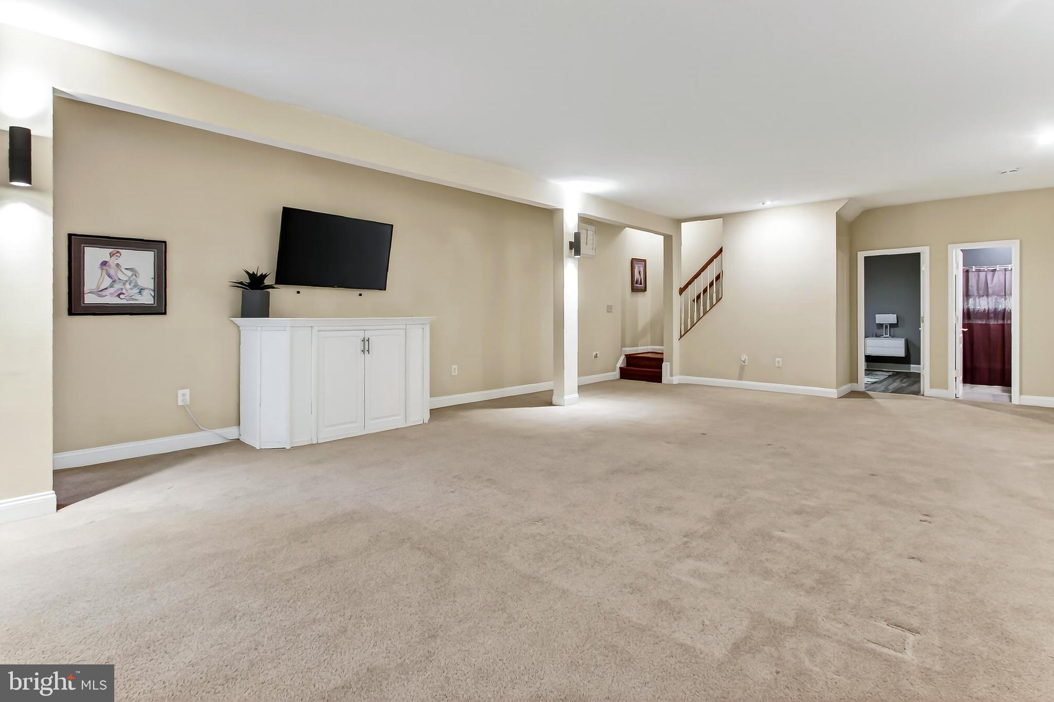8471 Link Hills Loop Gainesville, VA 20155 - Photo 48 of 65 a view of a livingroom with a flat screen tv