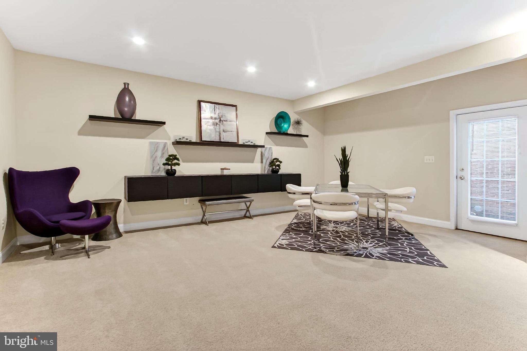 8471 Link Hills Loop Gainesville, VA 20155 - Photo 49 of 65 a living room with furniture and a rug
