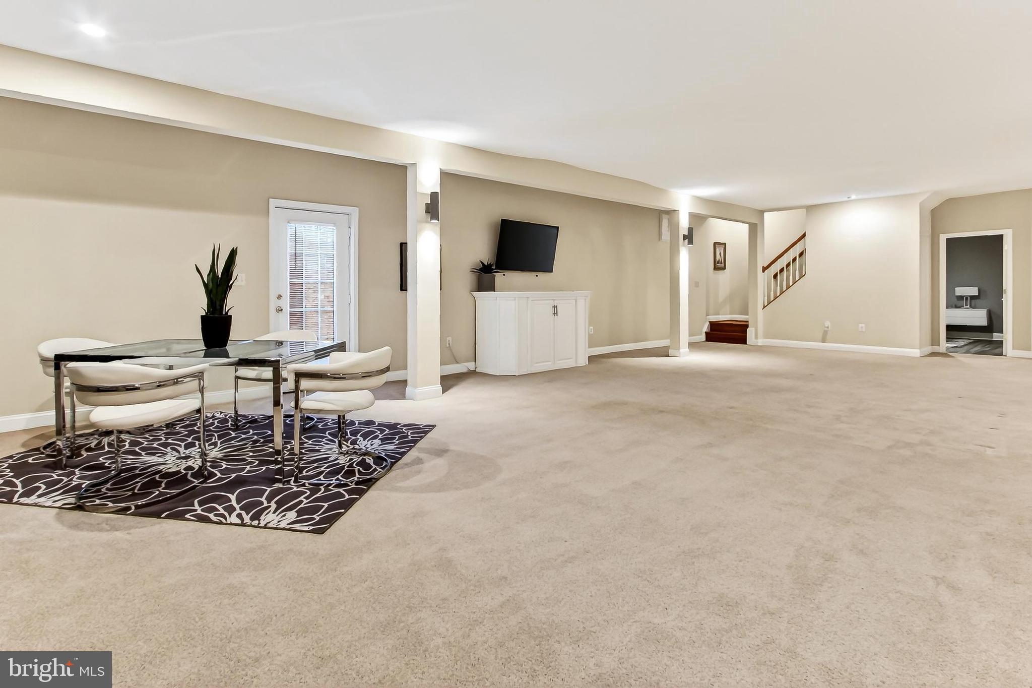 8471 Link Hills Loop Gainesville, VA 20155 - Photo 50 of 65 a living room with furniture and a flat screen tv