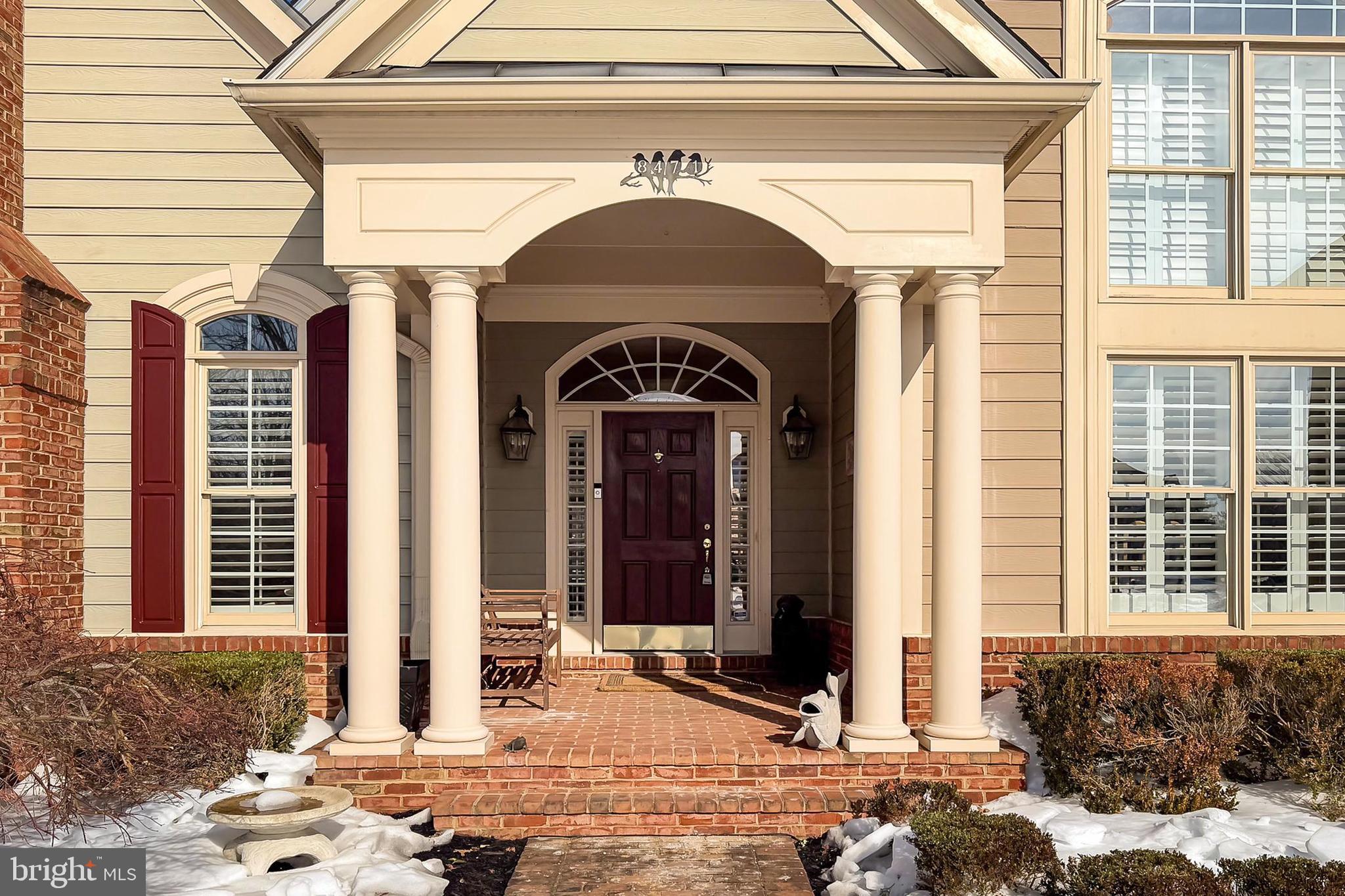 8471 Link Hills Loop Gainesville, VA 20155 - Photo 5 of 65 a view of a entrance door of the house