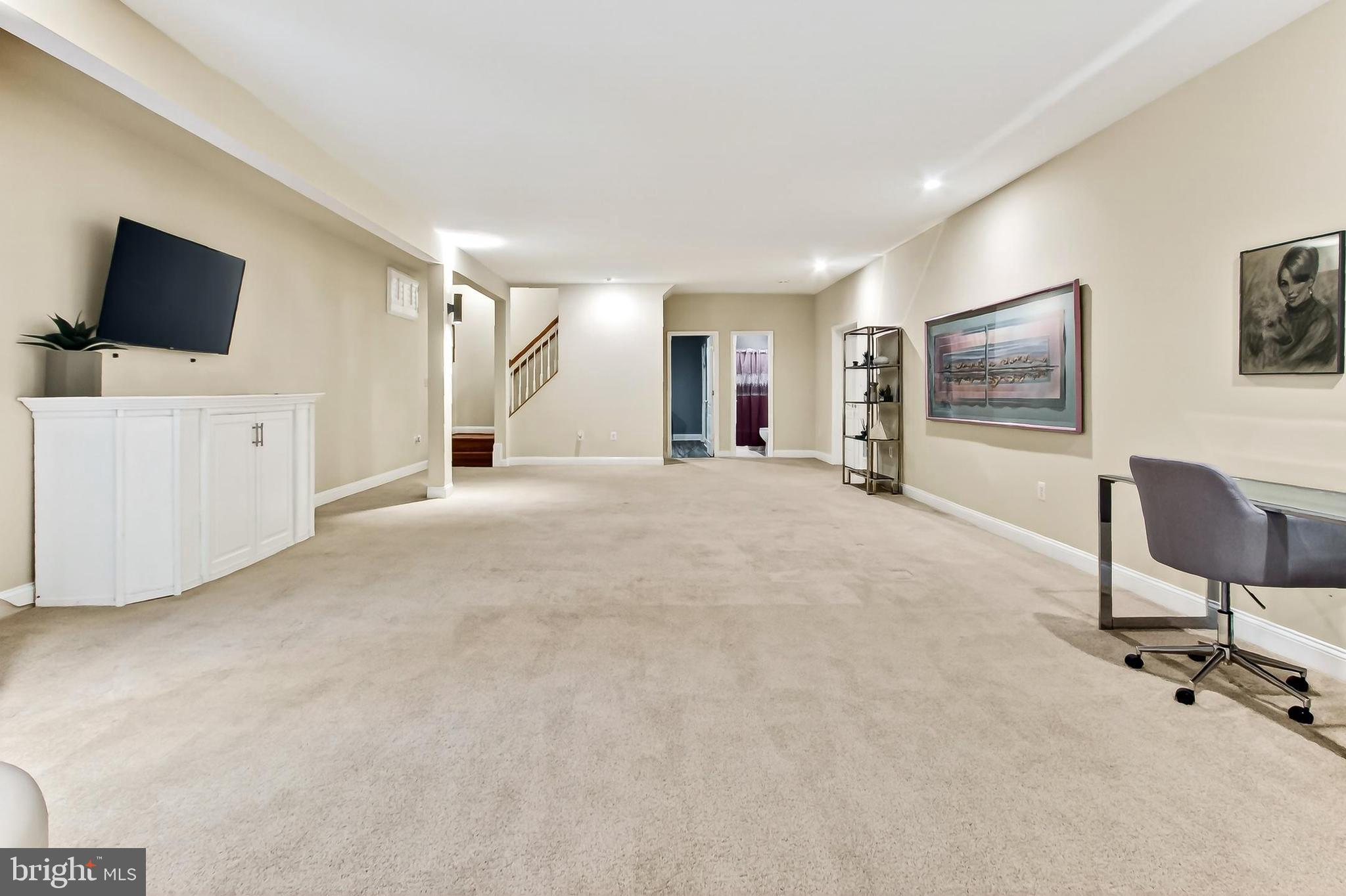 8471 Link Hills Loop Gainesville, VA 20155 - Photo 51 of 65 a view of a livingroom with furniture and a flat screen tv