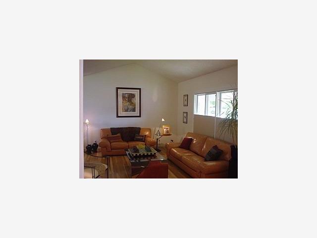 1526 South Stelling Road Cupertino, CA 95014 - Photo 2 of 7 a living room with furniture and a mirror