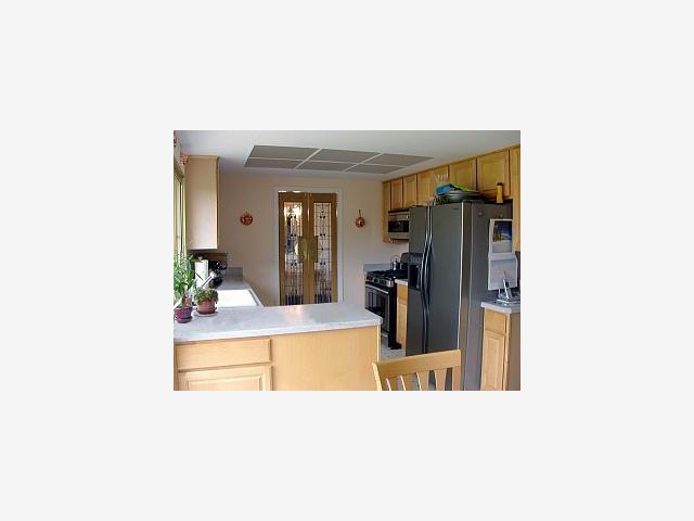 1526 South Stelling Road Cupertino, CA 95014 - Photo 4 of 7 a view of a living room with a sink and a large mirror