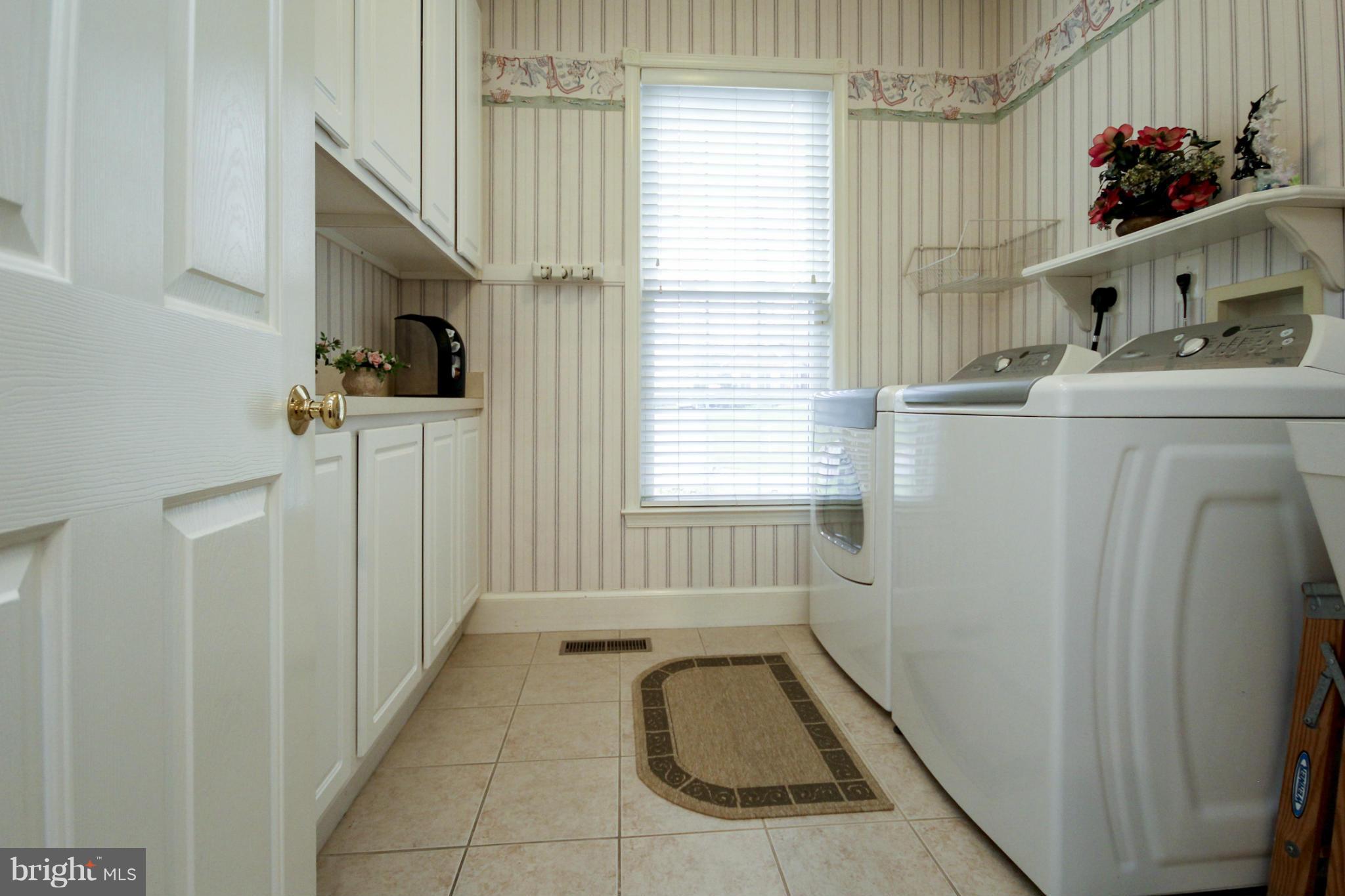 7890 Pembridge Road Manassas, VA 20112 - Photo 16 of 25 Laundry Room with Wall of Cabinets
