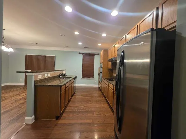a kitchen with refrigerator and car