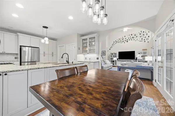 a large kitchen with sink and cabinets