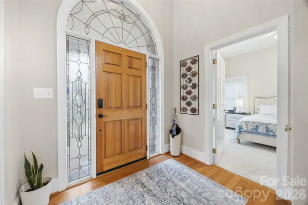a view of an entryway with wooden floor