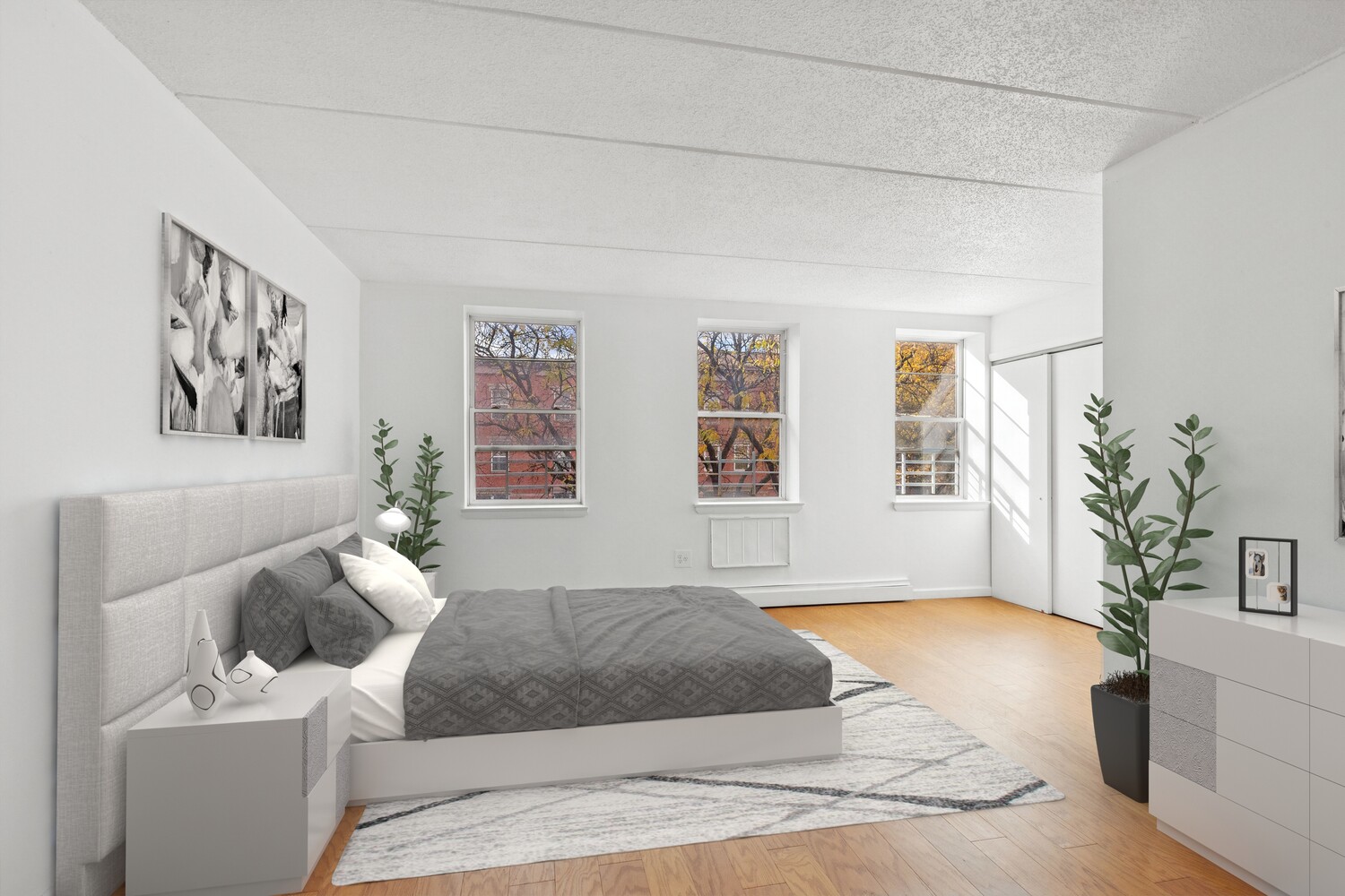 323 East 119th Street, Unit 2 Manhattan, NY 10035 - Photo 5 of 12 a bedroom with a bed and a couch