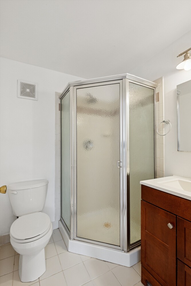 323 East 119th Street, Unit 2 Manhattan, NY 10035 - Photo 9 of 12 a bathroom with a toilet a sink and shower