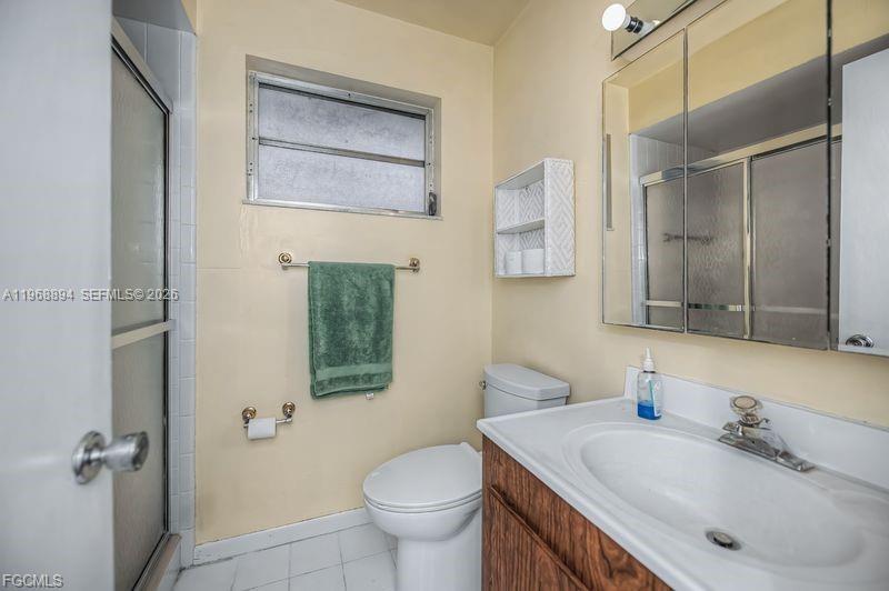 1209 County Road LaBelle, FL 33935 - Photo 30 of 40 a bathroom with a sink toilet and mirror