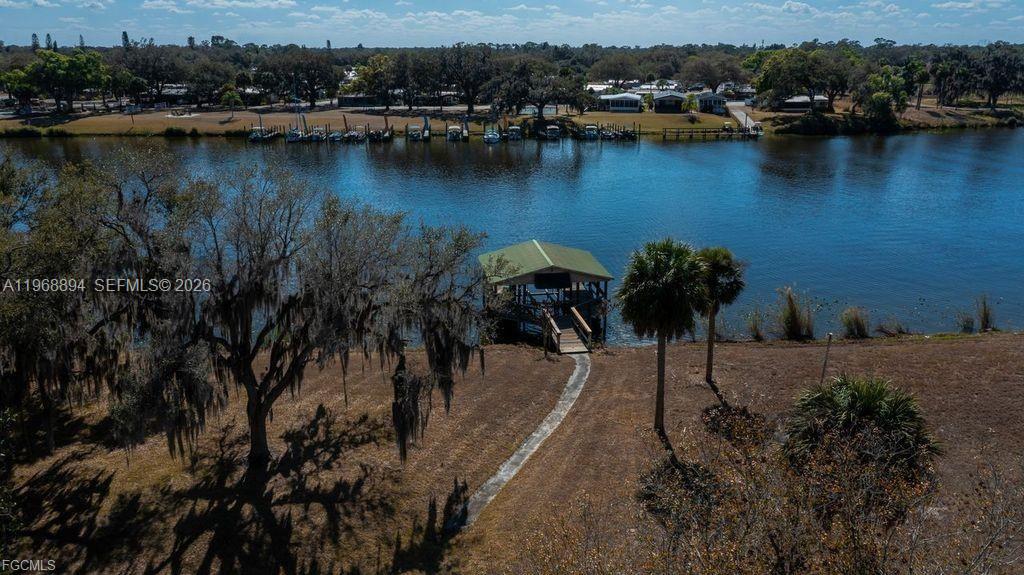 1209 County Road LaBelle, FL 33935 - Photo 33 of 40 an aerial view of residential houses with outdoor space and lake view