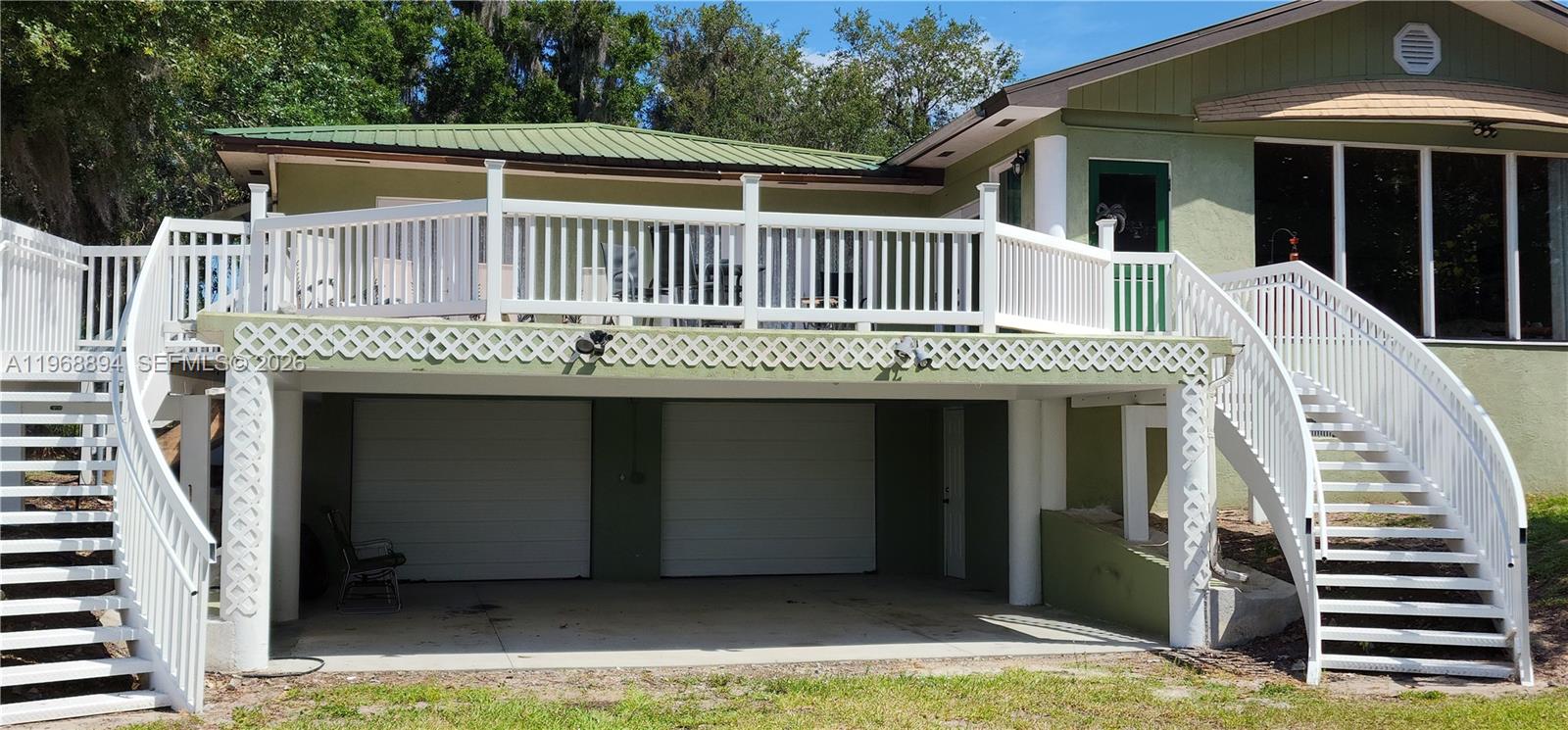 1209 County Road LaBelle, FL 33935 - Photo 7 of 40 a front view of a house with garage